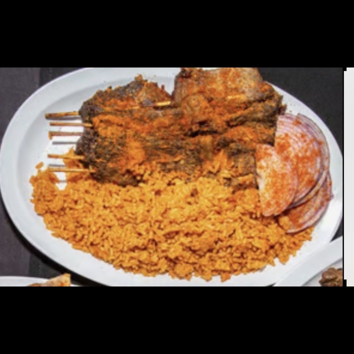 Suya sticks with jollof rice